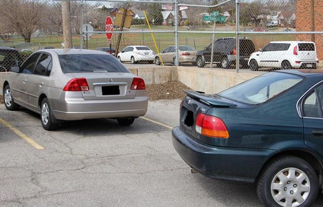 Students creating parking spaces can cause problems for other drivers. 