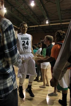 Senior Trey-Von Childs is greeted at the beginning of the HCP vs. Dove Tulsa game.