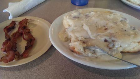 Biscuits with bacon gravy and a side of bacon