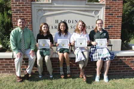 (left to right) Principal Justin Hunt, Mackenzie Sloan, Jennifer Rodriguez, Hannah Mitchell, and Sailor Whitbeck smile with their rewards.