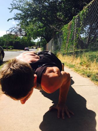 William Mlekush does one handed push-ups at calisthenics club