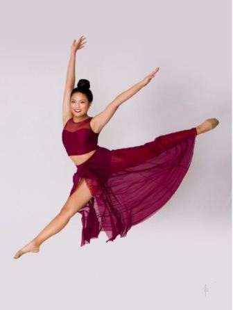 Taryn Nguyen is shown above posing midair.