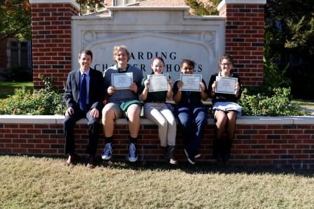 The October 2017 Awesome Eagles with principal Dr. Mylo Miller: Gage Catteeuw, Jesslyn Chain, Monica Money and Lydia Sharpe.