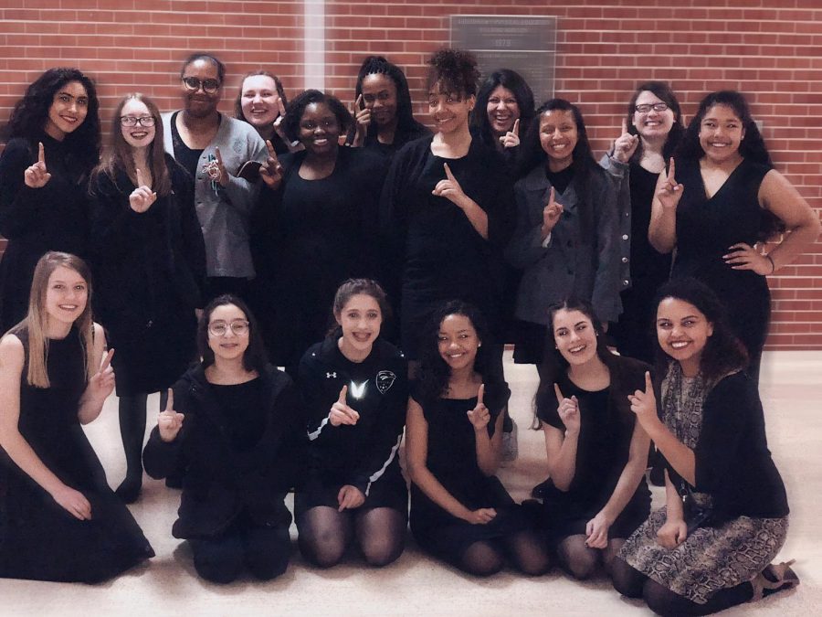 The+Womens+choir++celebrates+their+Superior+rating+after+their+performance+at+district+contest.