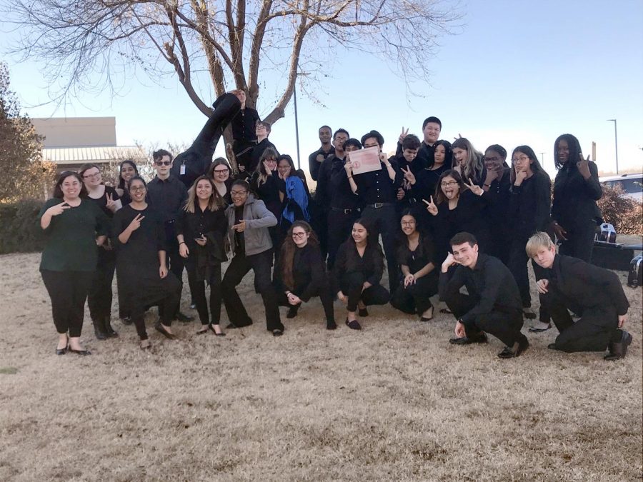 HCP Orchestra students pose outside Edmond Santa Fe High School with their Excellent rating certificate. 