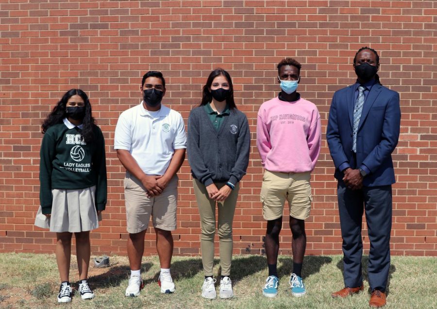 Junior Jocelyn Ramirez, sophomore Ronald Alvarado, freshman Meha Joseph and senior Emanuyel Brown, pictured with Principal Joe Hughes, were recognized as the September Awesome Eagles.