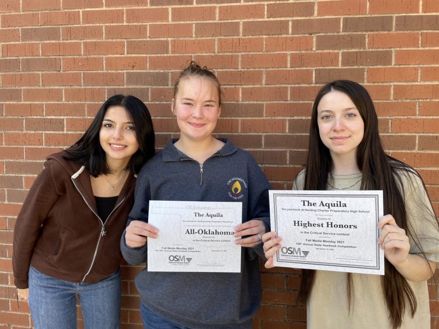 2021 Aquila Yearbook staff Lynda Martinez, Korbin Nida and Kristen Higgins show off their staff awards from the Oklahoma Scholastic Media. 