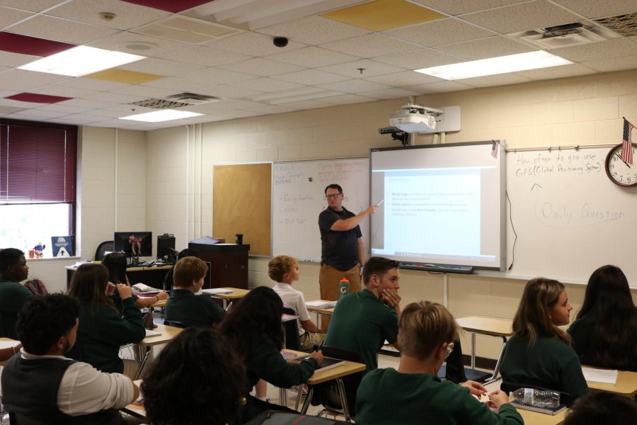 Clay McNeill uses the Smartboard with his fourth hour freshman history class.