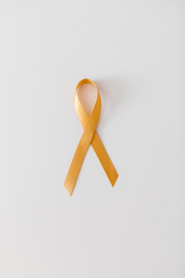 the yellow ribbon is a symbol for suicide awareness (Pexels)
