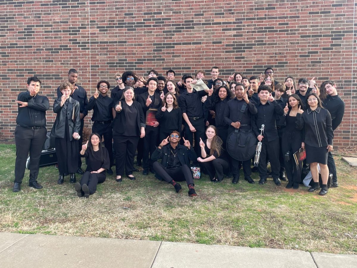 The+HCP+Concert+Band+puts+up+number+ones+for+everyone+to+see+after+earning+a+Superior+rating+at+the+OSSAA+District+Large+Group+contest+on+March+6.+With+their+rating%2C+they+qualified+for+the+state+contest+for+the+second+time+in+school+history.