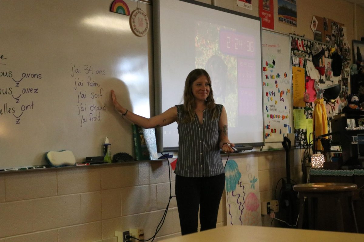 Smreker introduces the French stem Avoir, or "to have" in English, to her French 2 class.