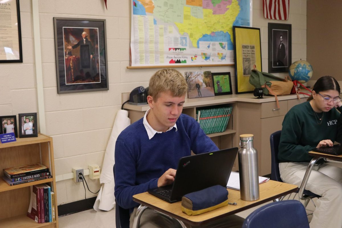 Exchange student Tony Weigelt works on english work during study hall in advisory. "Its exciting, I was nervous before, going to school, but now its just fun."