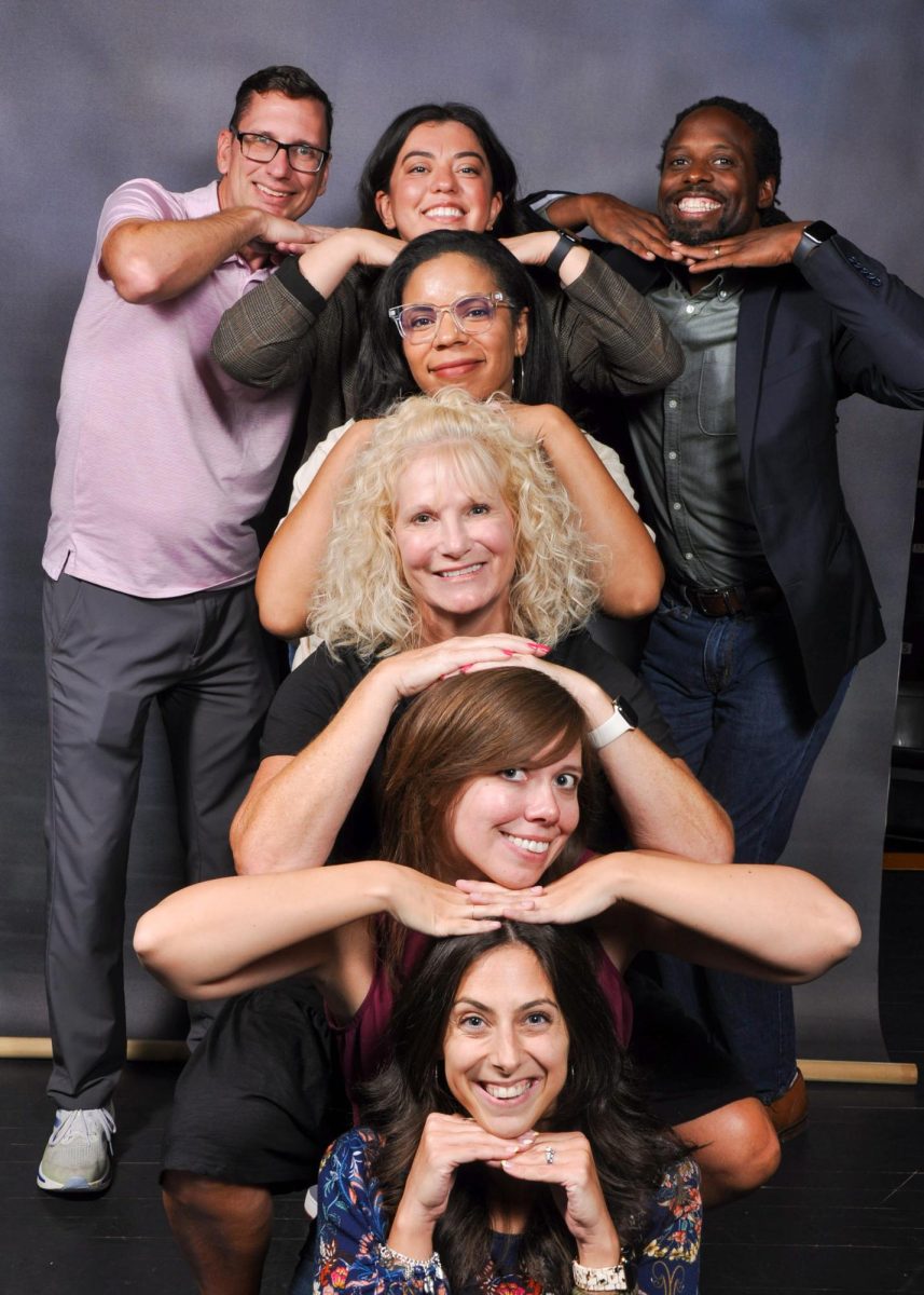 The new deans and principals take a light-hearted photo together for yearbook picture day.